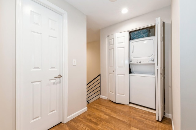 260 W Broadway Unit 2B, Long Beach, NY 11561 - laundry area with stacked washer and clothes dryer, light wood-style floors, baseboards, and recessed lighting