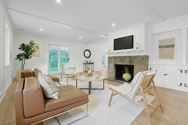 92 Glenwood Ave, New Rochelle, NY 10801 - living area featuring light wood-style flooring, a fireplace, recessed lighting, and beam ceiling
