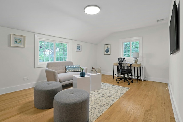 92 Glenwood Ave, New Rochelle, NY 10801 - home office featuring lofted ceiling, light wood-style flooring, and radiator heating unit