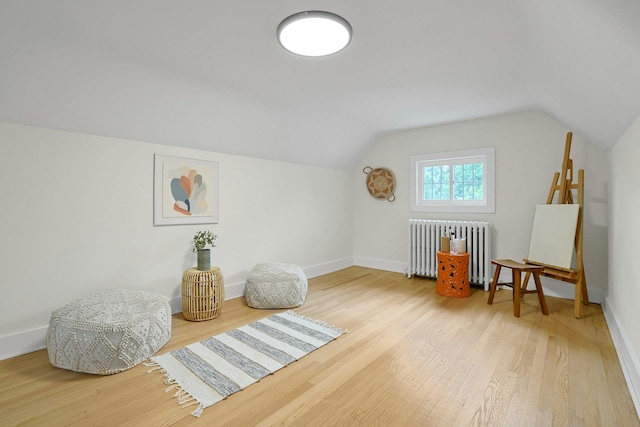 92 Glenwood Ave, New Rochelle, NY 10801 - additional living space with radiator, wood finished floors, and vaulted ceiling
