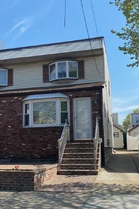 view of front of property featuring brick siding