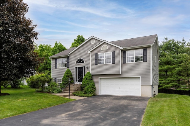 84 Autumn Dr, Poughkeepsie, NY 12603 - bi-level home featuring driveway, an attached garage, and a front yard