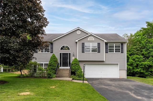 84 Autumn Dr, Poughkeepsie, NY 12603 - bi-level home with an attached garage, asphalt driveway, and a front lawn