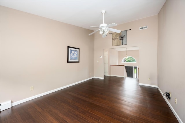 84 Autumn Dr, Poughkeepsie, NY 12603 - unfurnished living room featuring ceiling fan, baseboards, wood finished floors, and a high ceiling