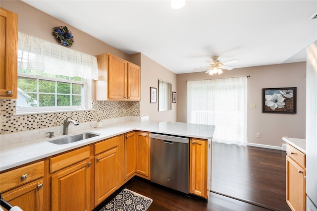 84 Autumn Dr, Poughkeepsie, NY 12603 - kitchen featuring dishwasher, a sink, a peninsula, light countertops, and decorative backsplash