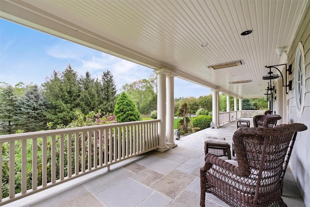 7 Ridgeview Cir, Armonk, NY 10504 - view of patio / terrace with covered porch and view of scattered trees