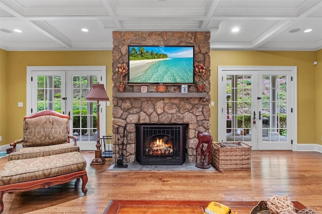 7 Ridgeview Cir, Armonk, NY 10504 - sitting room with french doors, coffered ceiling, wood finished floors, baseboards, and a stone fireplace
