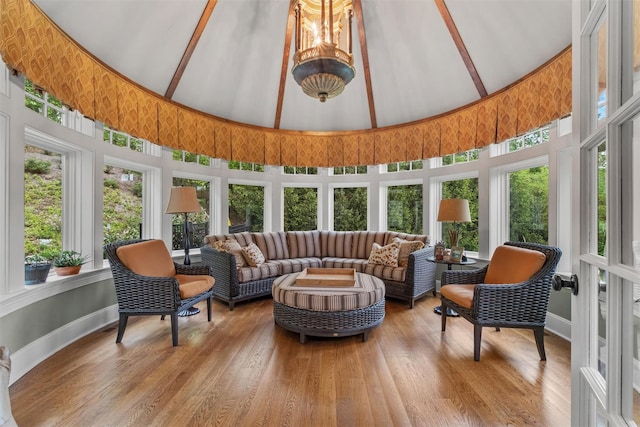 7 Ridgeview Cir, Armonk, NY 10504 - sunroom featuring high vaulted ceiling, baseboards, wood finished floors, and a wooden deck