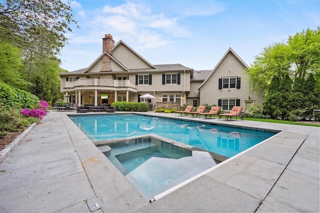 7 Ridgeview Cir, Armonk, NY 10504 - view of swimming pool with a patio, a pool with connected hot tub, and outdoor lounge area