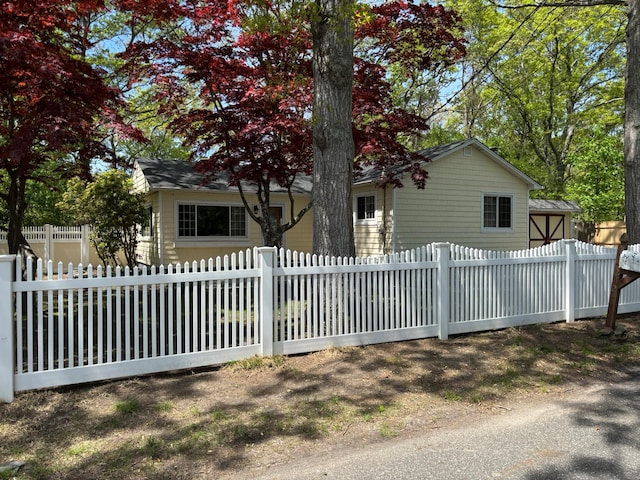 212 Longfellow Dr, Mastic Beach, NY 11951 - view of front of house with a fenced front yard