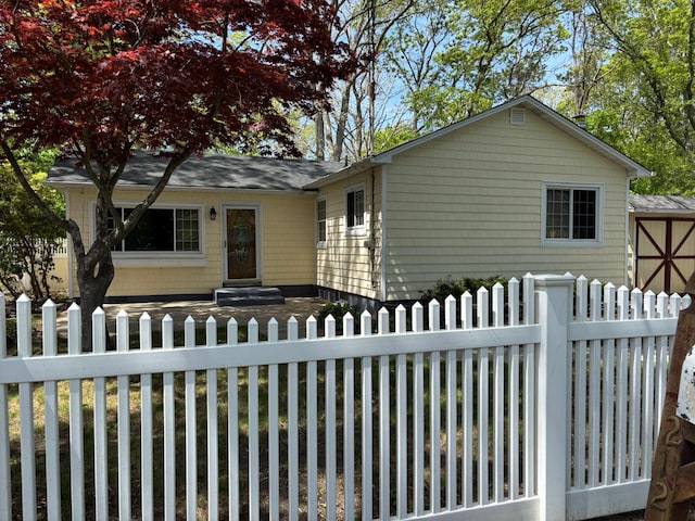 212 Longfellow Dr, Mastic Beach, NY 11951 - view of front of house with a fenced front yard