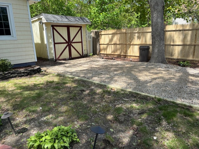 212 Longfellow Dr, Mastic Beach, NY 11951 - view of yard featuring a storage shed, fence, and an outdoor structure