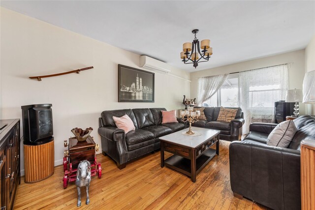 71-34 Kissena Blvd, Flushing, NY 11367 - living room with a wall unit AC, a chandelier, light wood-style floors, and baseboards