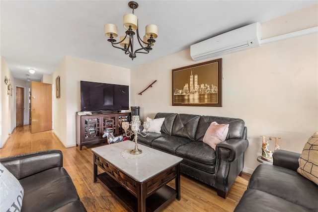 71-34 Kissena Blvd, Flushing, NY 11367 - living room with a wall unit AC, light wood-style flooring, a chandelier, and baseboards