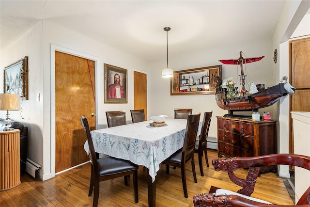 71-34 Kissena Blvd, Flushing, NY 11367 - dining space featuring hardwood / wood-style flooring, a baseboard radiator, and baseboards