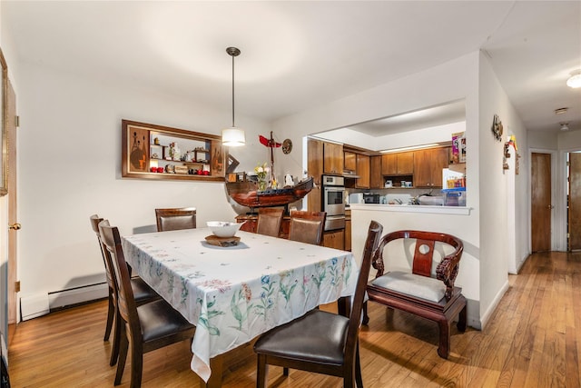 71-34 Kissena Blvd, Flushing, NY 11367 - dining room with light wood-style floors and baseboard heating