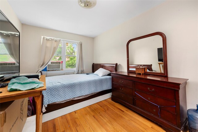 71-34 Kissena Blvd, Flushing, NY 11367 - bedroom featuring light wood finished floors and cooling unit