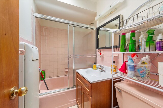 71-34 Kissena Blvd, Flushing, NY 11367 - bathroom featuring enclosed tub / shower combo, vanity, and toilet