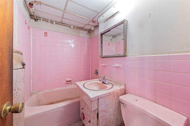 71-34 Kissena Blvd, Flushing, NY 11367 - bathroom with toilet, vanity, bathing tub / shower combination, tile walls, and wainscoting
