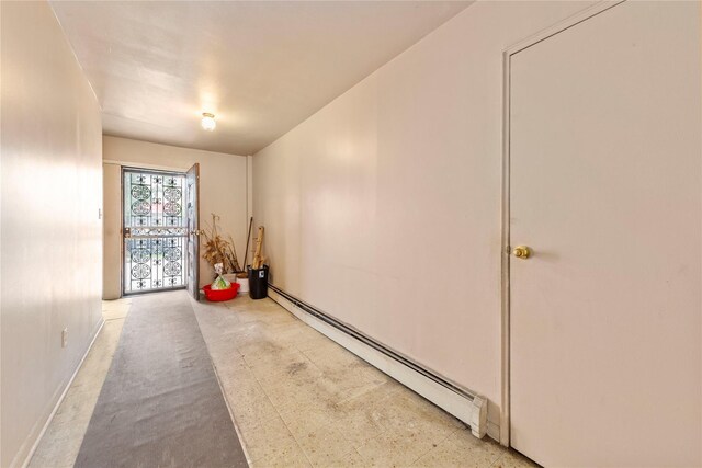 71-34 Kissena Blvd, Flushing, NY 11367 - hallway featuring a baseboard radiator and baseboards