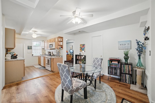 135 Highland Ave S Unit D1, Ossining, NY 10562 - dining area with ceiling fan, light wood-type flooring, and beam ceiling