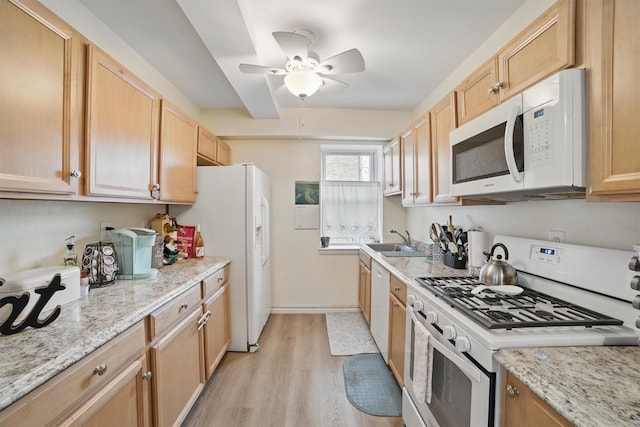 135 Highland Ave S Unit D1, Ossining, NY 10562 - kitchen featuring white appliances, a sink, light wood-type flooring, ceiling fan, and light stone counters