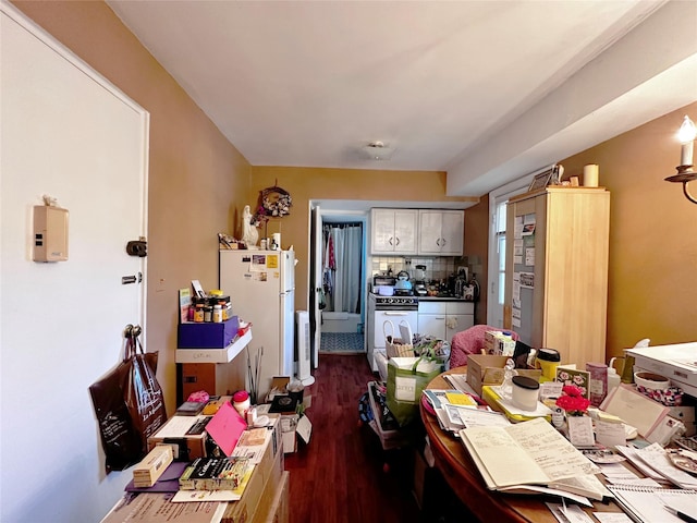 dining area with dark wood-style flooring