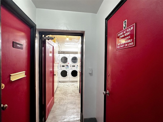 shared laundry room with estacked washer and dryer and washer and clothes dryer