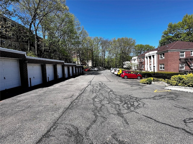 view of street featuring community garages and a residential view