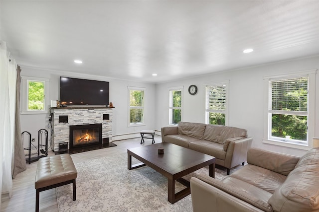 21 Wagon Ln, Brewster, NY 10509 - living room featuring light wood-style floors, a fireplace, recessed lighting, and a baseboard heating unit