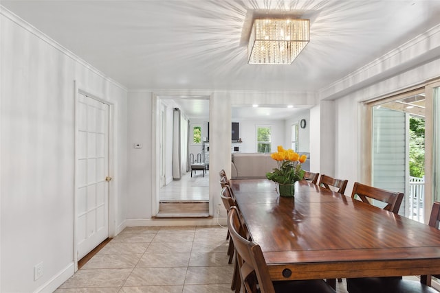 21 Wagon Ln, Brewster, NY 10509 - dining area with plenty of natural light, a chandelier, light tile patterned floors, crown molding, and baseboards