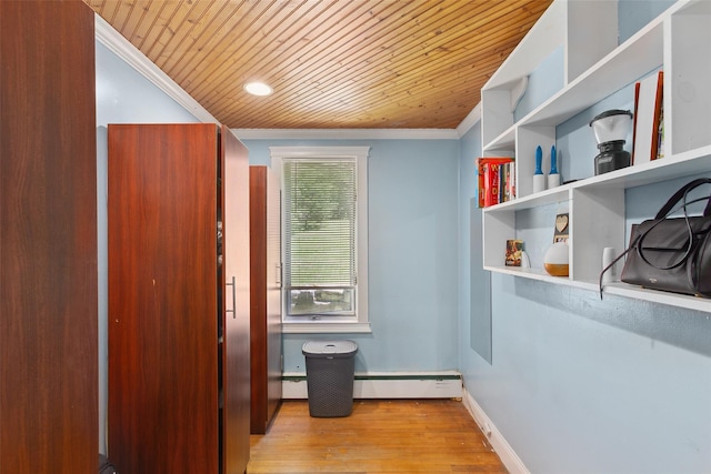 21 Wagon Ln, Brewster, NY 10509 - entryway with crown molding, wooden ceiling, baseboard heating, wood finished floors, and baseboards