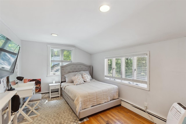 21 Wagon Ln, Brewster, NY 10509 - bedroom with a baseboard heating unit, lofted ceiling, light wood finished floors, an office area, and recessed lighting