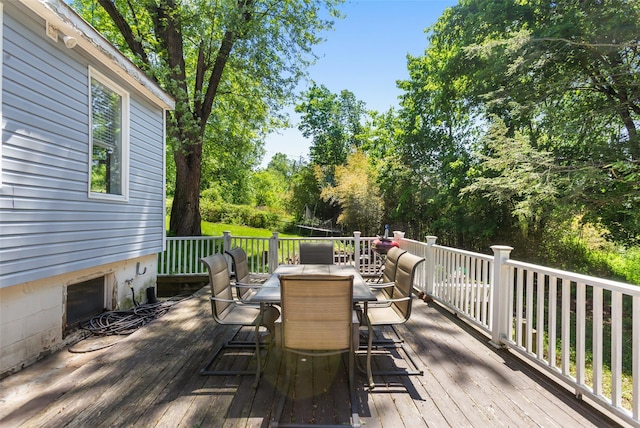 21 Wagon Ln, Brewster, NY 10509 - wooden deck featuring outdoor dining space and view of wooded area
