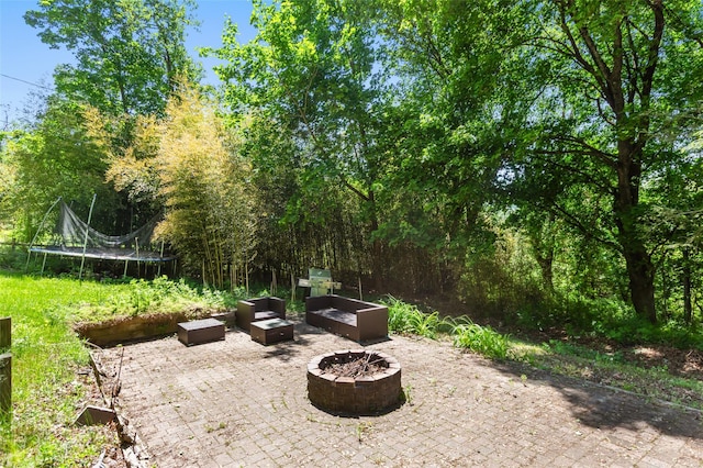 21 Wagon Ln, Brewster, NY 10509 - view of patio with a fire pit and a trampoline