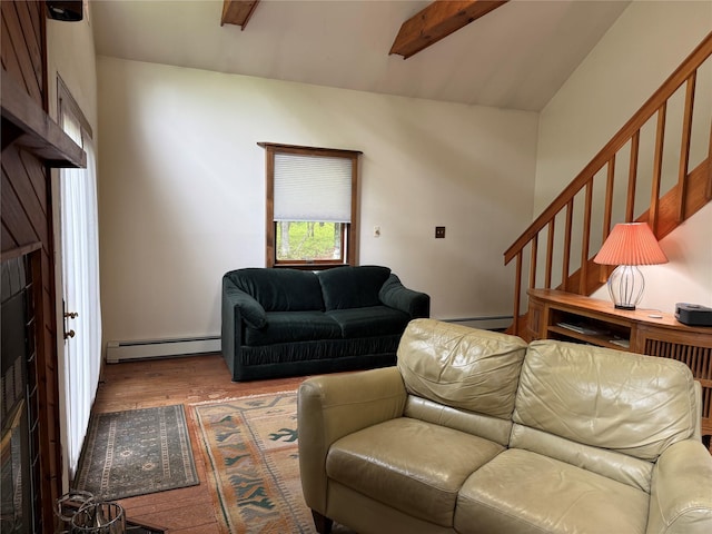 living area with a baseboard heating unit, wood finished floors, and a baseboard radiator