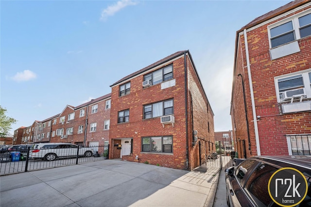 32-24 75th St, Jackson Heights, NY 11370 - view of property featuring fence and cooling unit