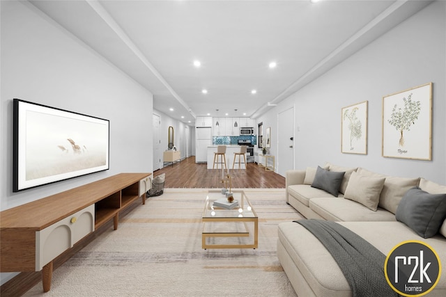 32-24 75th St, Jackson Heights, NY 11370 - living area with recessed lighting and wood finished floors