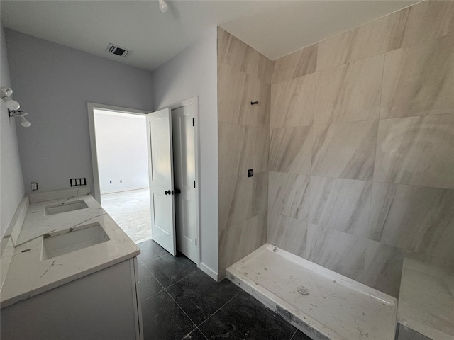 40 Wells Rd, Newburgh, NY 12550 - bathroom featuring a tile shower and double vanity