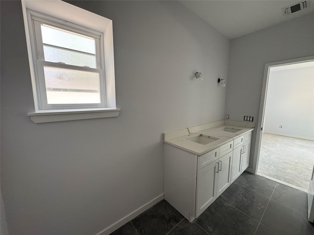 40 Wells Rd, Newburgh, NY 12550 - bathroom featuring baseboards, a sink, and tile patterned floors
