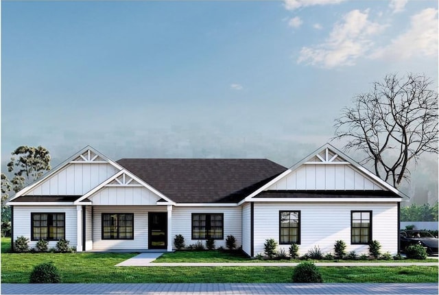 40 Wells Rd, Newburgh, NY 12550 - view of front facade featuring board and batten siding, a front lawn, and roof with shingles