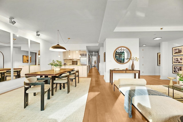 212 E 95th St, New York Manhattan, NY 10128 - dining room featuring baseboards and light wood finished floors