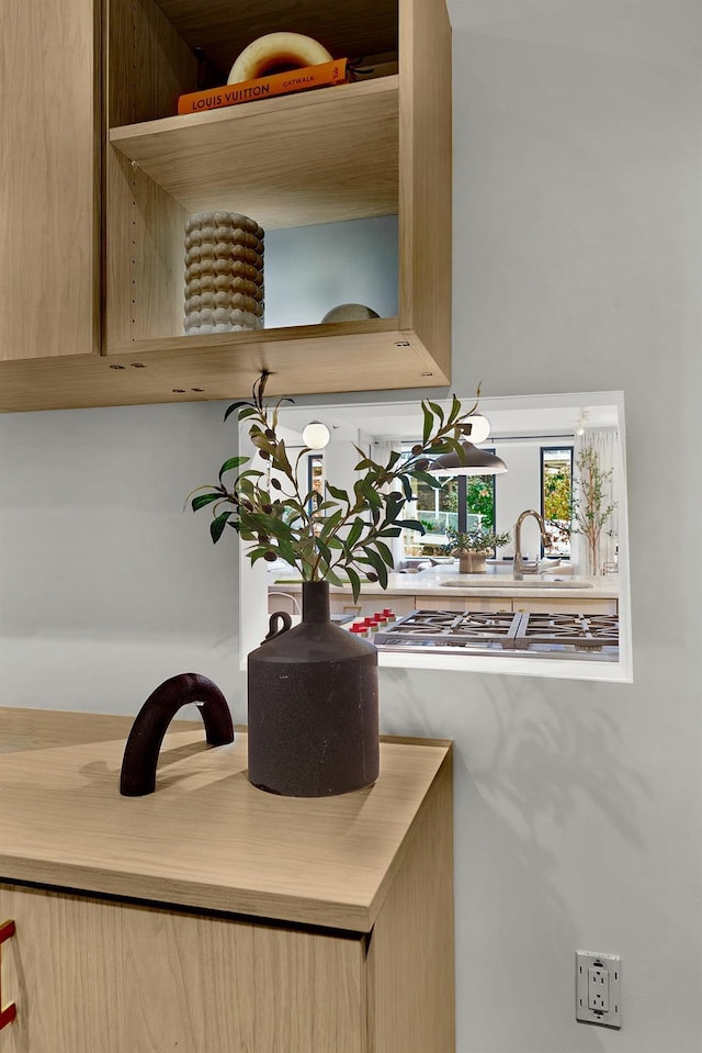 212 E 95th St, New York Manhattan, NY 10128 - detailed view of stainless steel gas stovetop and a sink