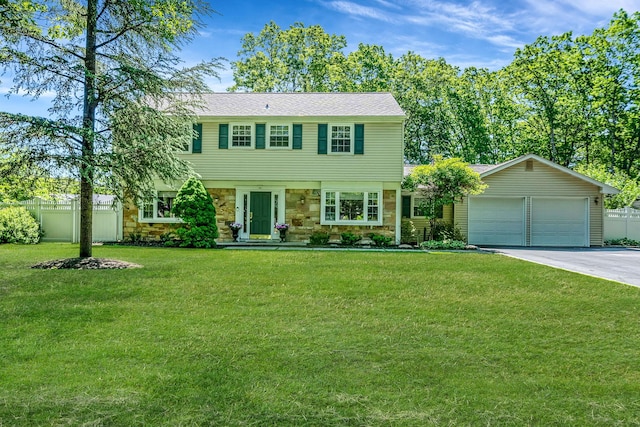 10 Patriot Ct, Stony Brook, NY 11790 - colonial house with stone siding, concrete driveway, and a garage