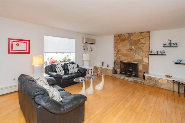 129 Boardman Rd, Poughkeepsie, NY 12603 - living room with a wall mounted air conditioner, hardwood / wood-style floors, a fireplace, baseboard heating, and radiator heating unit