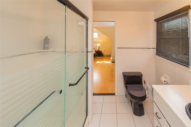 129 Boardman Rd, Poughkeepsie, NY 12603 - full bathroom featuring a shower stall, tile patterned floors, vanity, and toilet