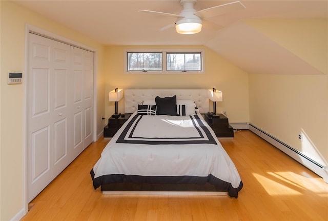 129 Boardman Rd, Poughkeepsie, NY 12603 - bedroom featuring baseboard heating, wood finished floors, and vaulted ceiling