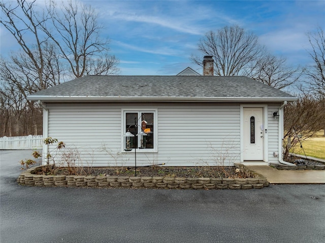 129 Boardman Rd, Poughkeepsie, NY 12603 - view of side of home with a chimney, fence, and a shingled roof
