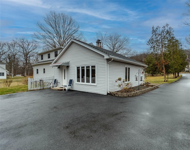 129 Boardman Rd, Poughkeepsie, NY 12603 - rear view of house with fence and asphalt driveway