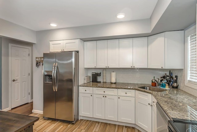 51 Andrews Ave, Wyandanch, NY 11798 - kitchen featuring stainless steel appliances, light wood-type flooring, white cabinets, and recessed lighting